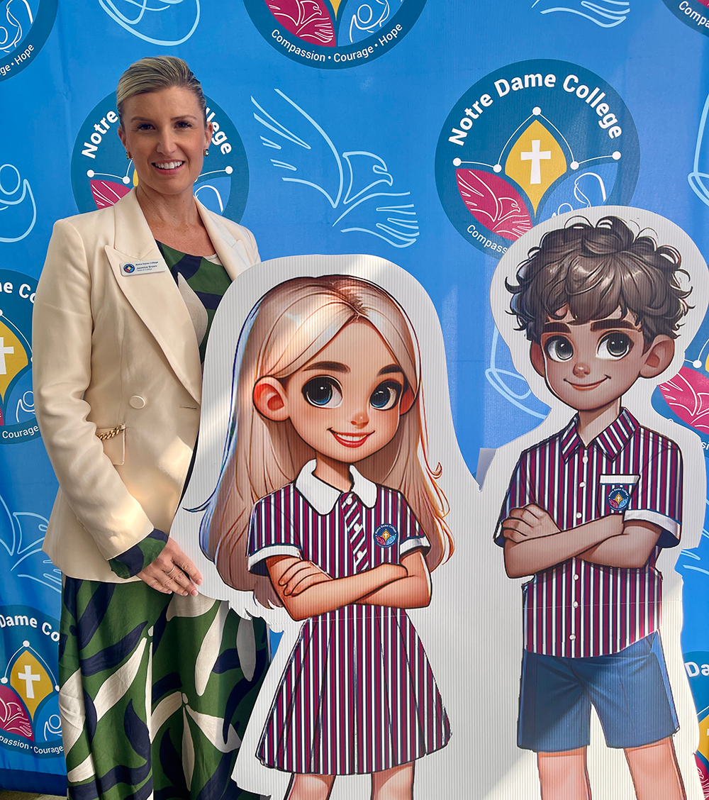 Jasmine Brown stands beside a life size poster of stylised images of a female and male students in the Notre Dame College uniform